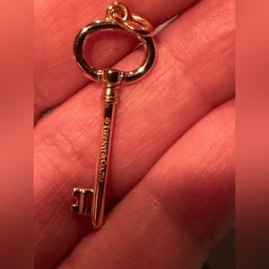 Tiffany & Co. Solid yellow gold key charm 14k